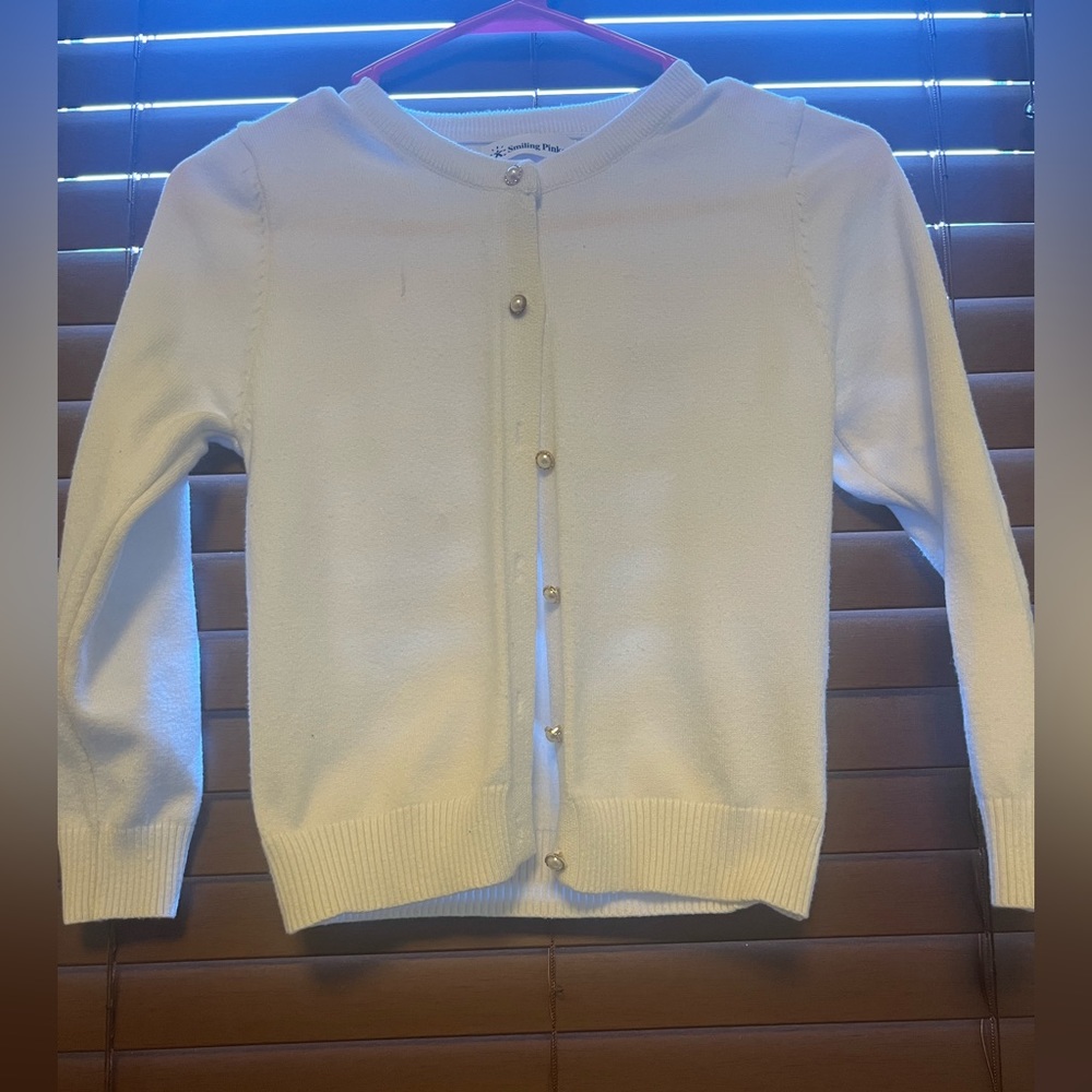 White long sleeve sweater.